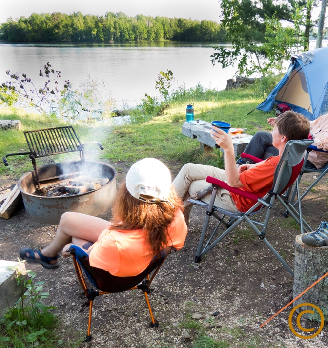 Enjoying the campfire and the view at Crane Creek Island after the day kayaking/canoeing on the Chippewa Flowage with a near Hayward, Wis. Sue Pischke, 2014 ALL RIGHTS RESERVED